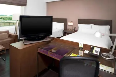 a hotel room with a desk with a tv and a bed at Element Vaughan Southwest in Vaughan
