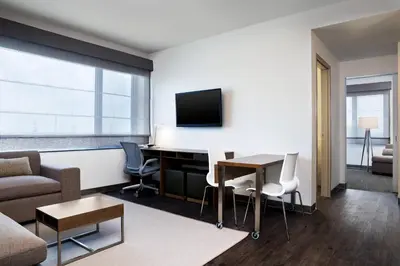 a living room with a desk and a tv at Element Vaughan Southwest in Vaughan