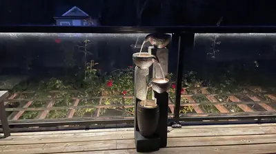 a bird feeder with two birds on a balcony at Abacot Hall Bed & Breakfast in Niagara on the Lake