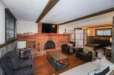 a living room with a couch and a fireplace at Dorchester Cottage Licence 044-2022 in Niagara on the Lake