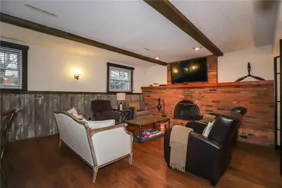 a living room with a couch and a fireplace at Dorchester Cottage Licence 044-2022 in Niagara on the Lake