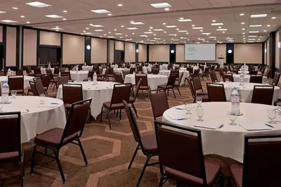 a conference room with white tables and chairs at Element Toronto Airport in Mississauga
