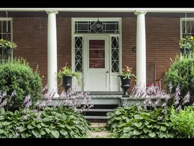a house with a white door and pillars at Culverdene House in Simcoe