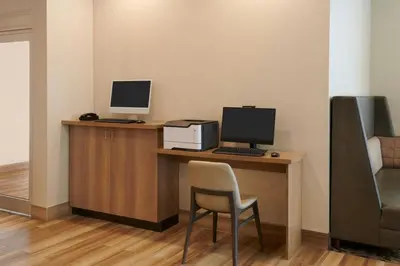 an office with a desk with a computer and a chair at Residence Inn by Marriott Toronto Mississauga Southwest in Mississauga