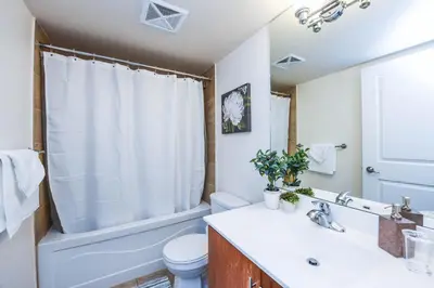 a bathroom with a sink and a toilet at PlanURstay - Luxury Suites Mississauga Downtown in Mississauga