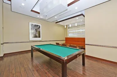 a pool table in a rec room with a ceiling at PlanURstay - Luxury Suites Mississauga Downtown in Mississauga