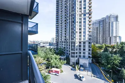 a view from a balcony of a large building at PlanURstay - Luxury Suites Mississauga Downtown in Mississauga