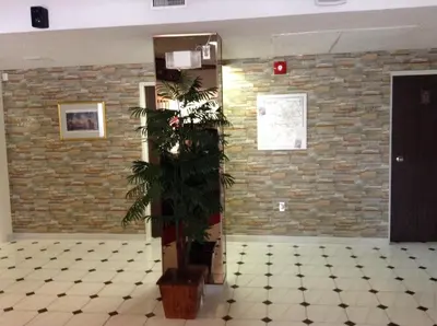 a plant in a room with a brick wall at Shakespeare Inn in Shakespeare
