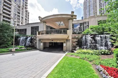 a building with a fountain in front of a building at PlanURstay - Luxury 1BR Condo with City View in Mississauga