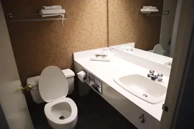 a bathroom with a toilet and a sink at Toronto Metropolitan University-International Living Learning Residence in Toronto