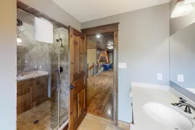 a bathroom with a shower and a sink at Lucille 109 in Blue Mountains
