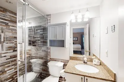 a bathroom with a toilet and a sink and a shower at Condo 904 at North Creek Resort in Blue Mountains