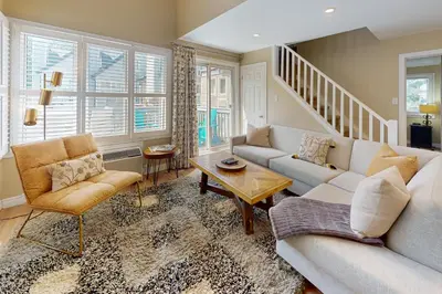 a living room with a couch and a table at Condo 413 at North Creek Resort by Vacasa in Blue Mountains