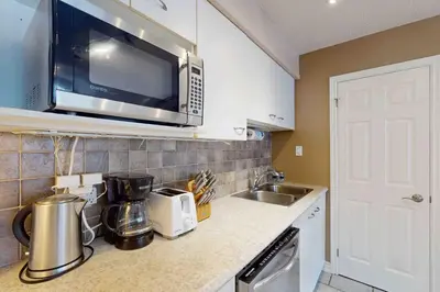 a kitchen with a microwave and a counter top at Condo 713 at North Creek Resort in Blue Mountains