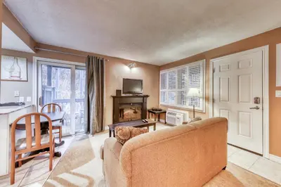 a living room with a couch and a table at Condo 903 at North Creek Resort in Blue Mountains