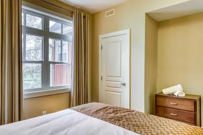 a bedroom with a bed and a window at Rivergrass 226 in Blue Mountains