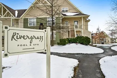 a sign in front of a house in the snow at Rivergrass 226 in Blue Mountains