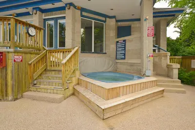 a house with a jacuzzi tub in the backyard at Condo 416 at North Creek Resort in Blue Mountains