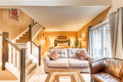 a living room with a couch and a bed at Condo 214 at North Creek Resort by Vacasa II in Blue Mountains