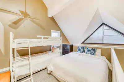 two bunk beds in a room with a window at Condo 214 at North Creek Resort by Vacasa II in Blue Mountains