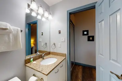 a bathroom with a sink and a mirror at Condo 212 at North Creek Resort by Vacasa in Blue Mountains
