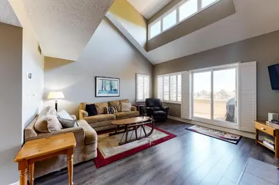 a living room with a couch and a table at Wintergreen 223 in Blue Mountains