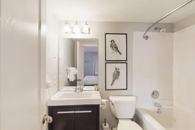 a bathroom with a sink toilet and a mirror at Condo 807 at North Creek Resort in Blue Mountains
