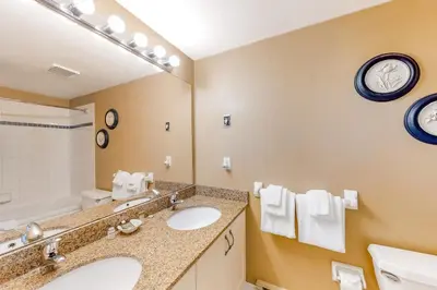 a bathroom with two sinks and a large mirror at Condo 505 at North Creek Resort in Blue Mountains