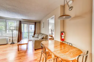 a living room with a table and a couch at Condo 305 at North Creek Resort in Blue Mountains