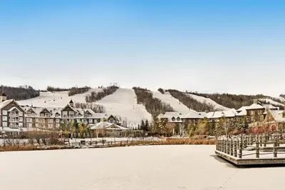 a view of a resort with snow covered buildings at Condo 305 at North Creek Resort in Blue Mountains