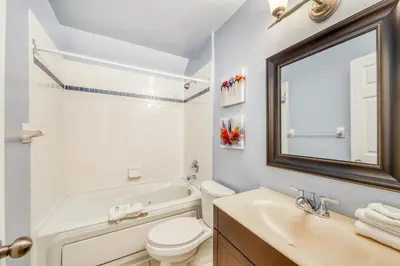 a bathroom with a sink and a toilet and a mirror at Condo 616 at North Creek Resort in Blue Mountains