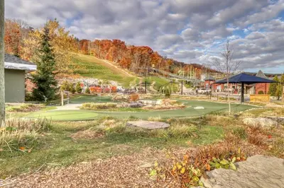 a golf course with a pond in the middle at Wintergreen 202 in Blue Mountains