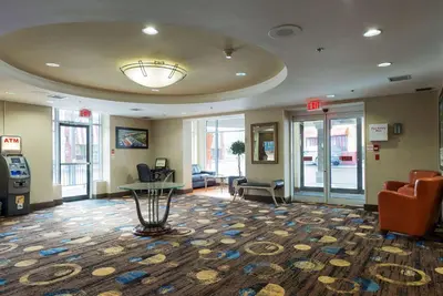 a waiting room with a slot machine in a building at Howard Johnson Plaza by Wyndham by the Falls Niagara Falls in Niagara Falls