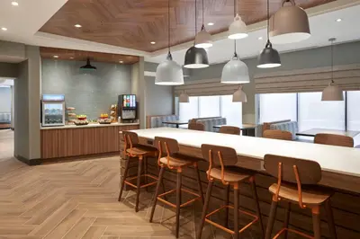 a large dining room with a large table and chairs at Fairfield by Marriott Niagara Falls, Canada in Niagara Falls