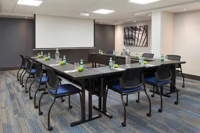 a conference room with a long table and chairs at Fairfield by Marriott Niagara Falls, Canada in Niagara Falls