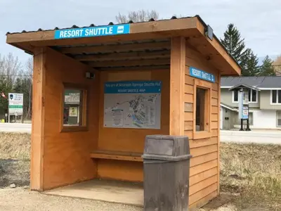 a wooden structure with a trash can in front of it at Mountainside Resort Condo at Blue in Blue Mountains