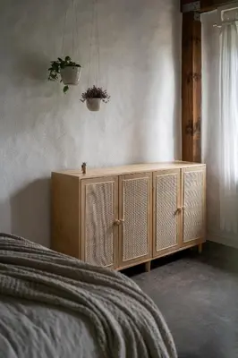 a wooden cabinet in a bedroom with a bed at Owl's Nest Suites in Carrying Place