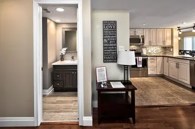 a kitchen with a table and a kitchen with a counter at Large luxurious upper floor condo in Sierra Lane in Blue Mountains