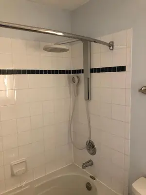 a bathroom with a bath tub with a shower at Artistic Hillside Loft in Blue Mountains