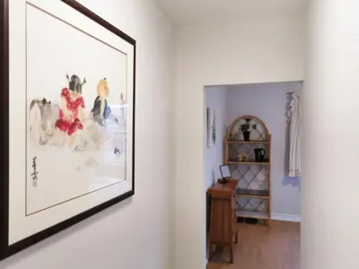 a picture hanging on a wall in a room at Cozy Private Rm Heart of North York Free Parking Full Kitchen Close to Downtown in Toronto