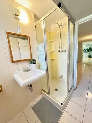 a bathroom with a sink and a shower at Cozy basement room-Private Bath - Near Subway line 1 - Toronto in Toronto