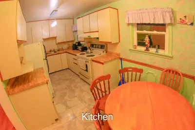a kitchen with a table and a dining room at Comfort Home Toronto in Toronto