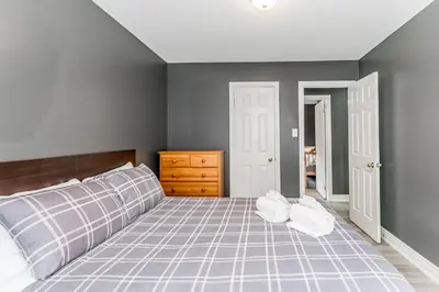 a bedroom with a bed with two pillows on it at Beach1 Riverfront Resort in Wasaga Beach