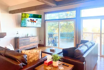 a living room with a couch and a table at Kawartha Lakes, Fenelon Falls in Fenelon Falls