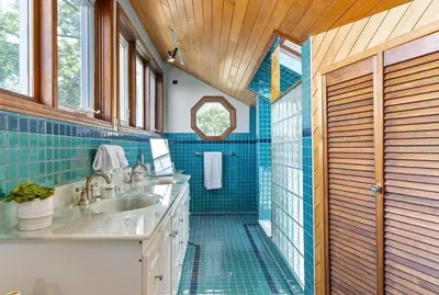 a bathroom with a sink and a shower with blue tiles at Kawartha Lakes, Fenelon Falls in Fenelon Falls