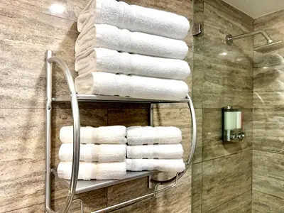 a bunch of towels on a towel rack in a bathroom at iResidence in Toronto - Fantastic Vacation Home with Breakfast in Toronto