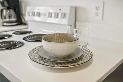 a bowl on a plate on top of a stove at Saga Resort in Wasaga Beach