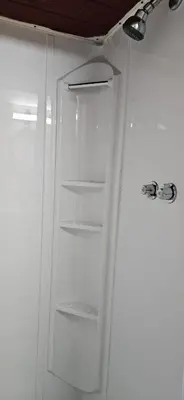 a white refrigerator with its door open in a kitchen at Trent River Cottages in Hastings