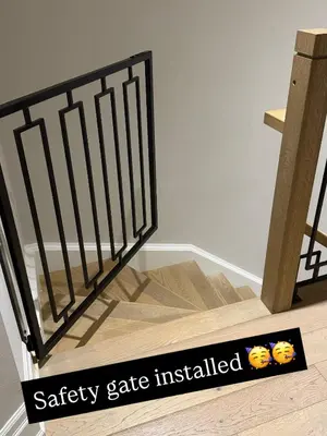 a safety gate installed next to a wooden staircase at Luxury Adventure, Rutherford Go station & Wonderland in Vaughan