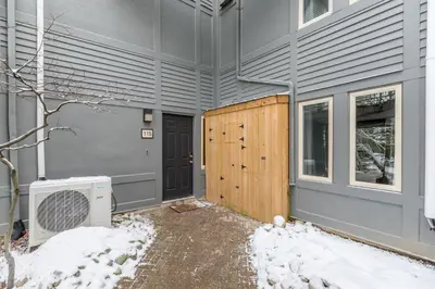 a front door of a house in the snow at 2 BR Ski In Out at Cachet Crossing, Sleeps 8 in Blue Mountains
